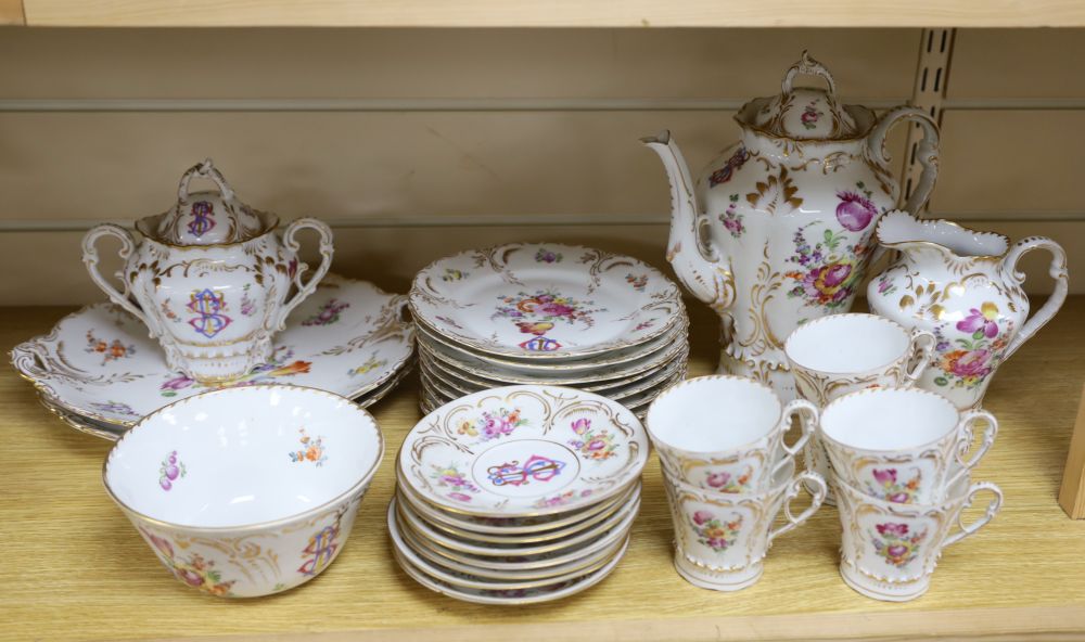 A 19th century Continental twenty nine piece gilt and floral coffee set, monogrammed, coffee pot 26cm